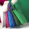 a range of coloured cotton carolina tote bags